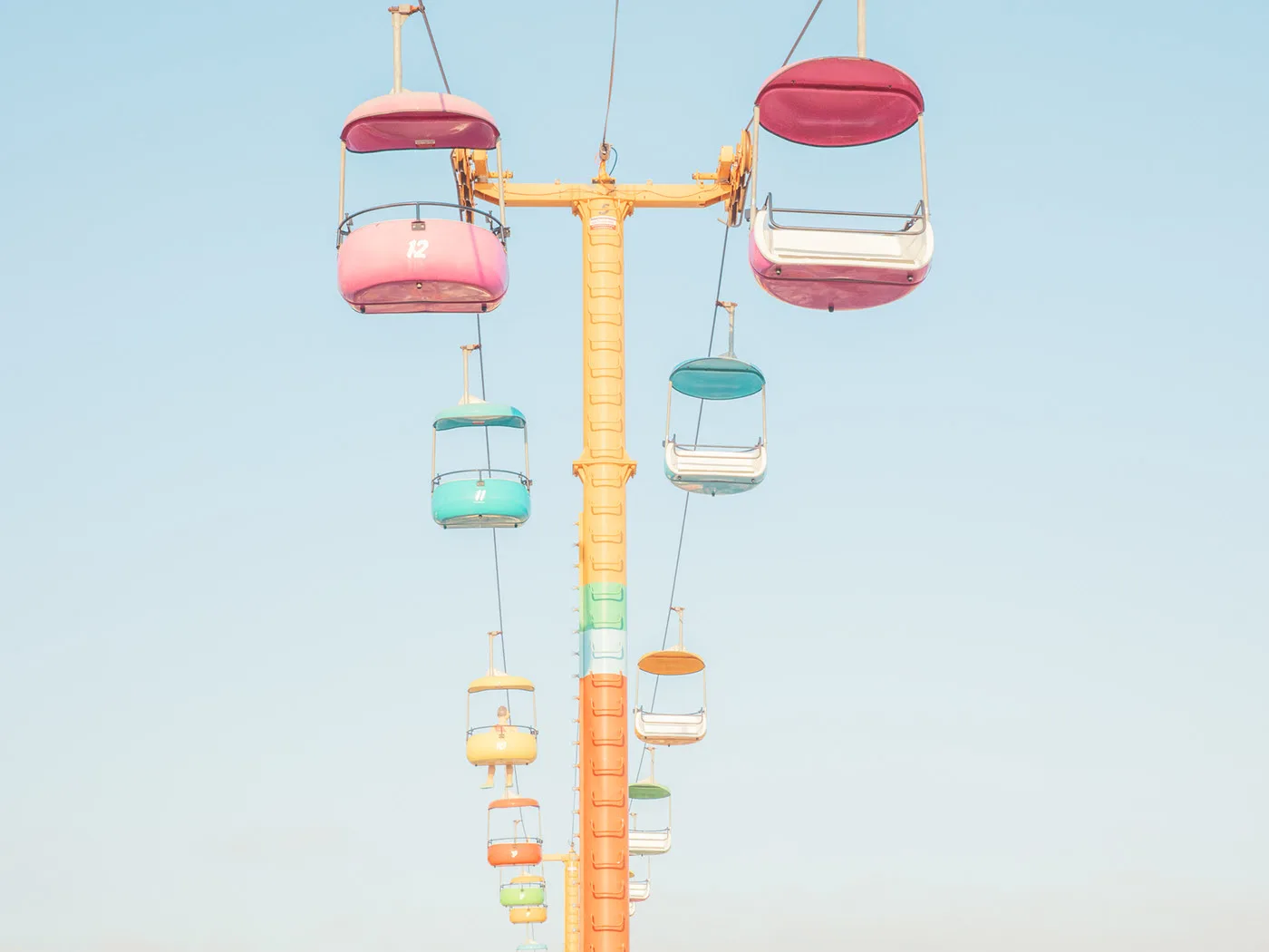 Colorful gondola lift tower against a clear, bright sky — limited edition fine art print by Ludwig Favre Colorful gondola lift tower against a clear, bright sky — limited edition fine art print by Ludwig Favre