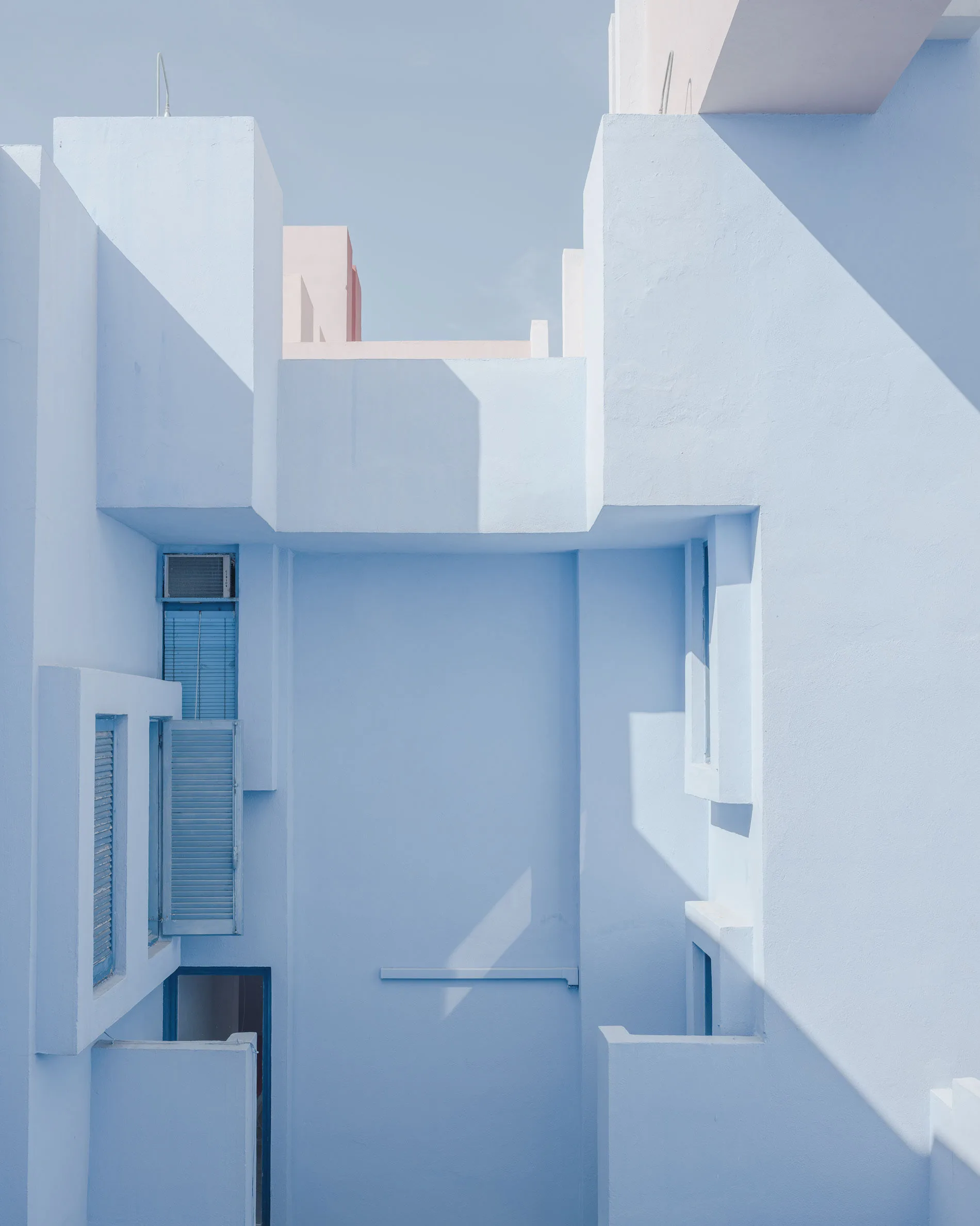 Minimalist architecture with layered balconies in quiet blue tones — limited edition fine art print by Ludwig Favre Minimalist architecture with layered balconies in quiet blue tones — limited edition fine art print by Ludwig Favre