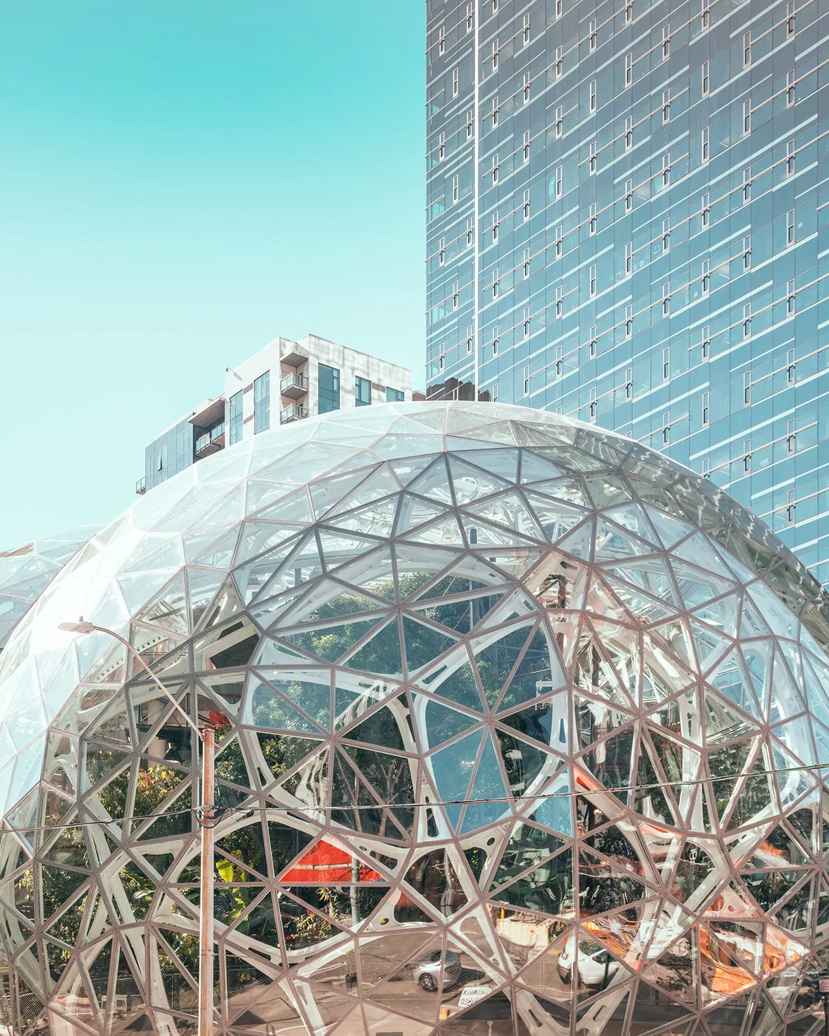 Geometric glass structure and modern building under a bright sky — limited edition fine art print by Ludwig Favre Geometric glass structure and modern building under a bright sky — limited edition fine art print by Ludwig Favre