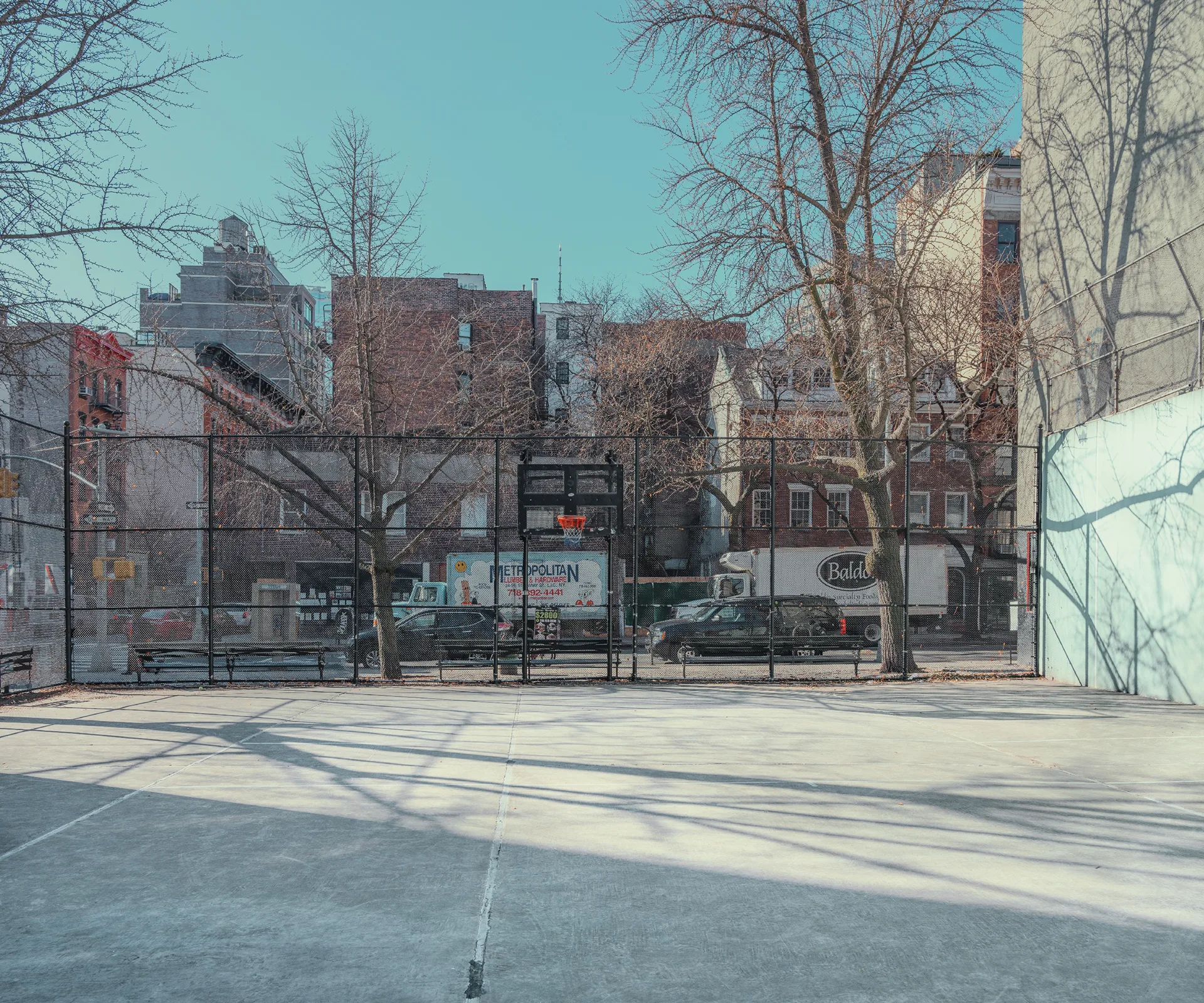 Quiet basketball court framed by brownstone buildings — limited edition fine art print by Ludwig Favre Quiet basketball court framed by brownstone buildings — limited edition fine art print by Ludwig Favre