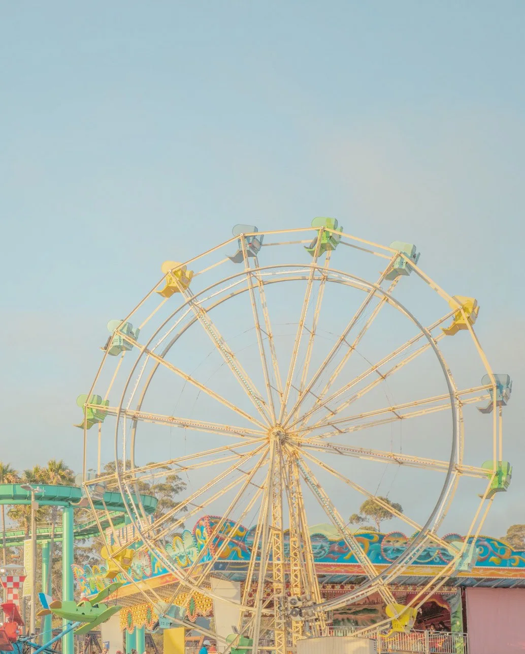 A vintage Ferris wheel and amusement park in warm light — limited edition fine art print by Ludwig Favre A vintage Ferris wheel and amusement park in warm light — limited edition fine art print by Ludwig Favre