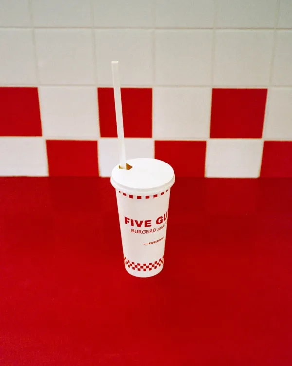 Five Guys cup on red and white checkered tiles in New York — limited edition fine art print by Ludwig Favre