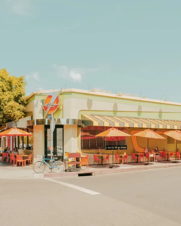 Retro diner scene in Los Angeles with orange chairs and yellow awnings — limited edition fine art print by Ludwig Favre