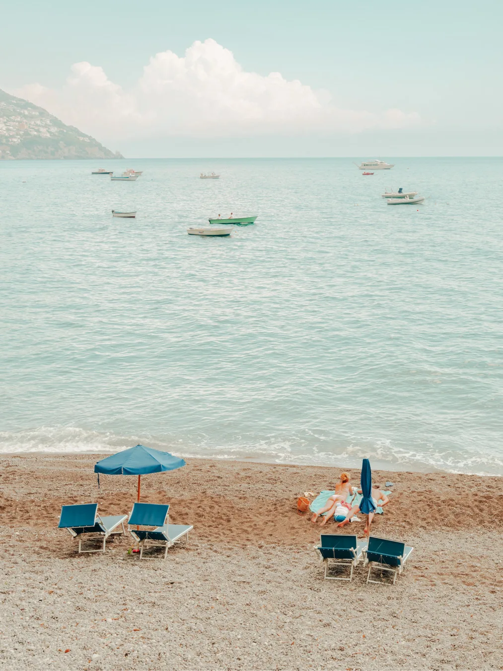 Positano, the Couple, limited edition Positano art print by Ludwig Favre Couple relaxing on a pebble beach — limited edition fine art print by Ludwig Favre