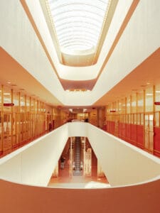 Interior view of San Francisco library with red and white curved — limited edition fine art print by Ludwig Favre