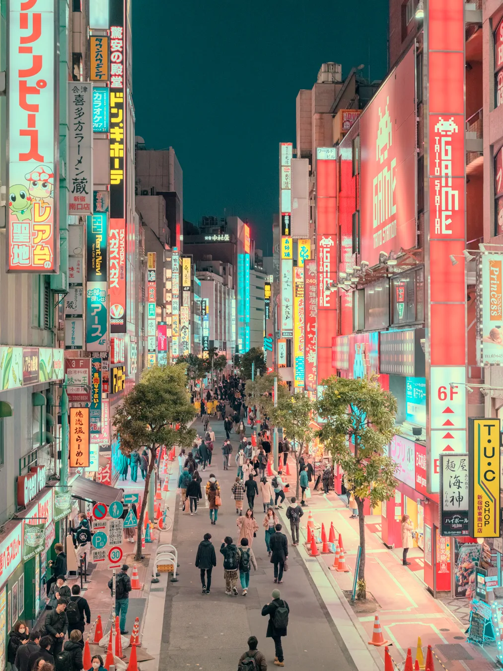 Tokyo's neon-lit streets at night, with pedestrians and vibrant signage — limited edition fine art print by Ludwig Favre