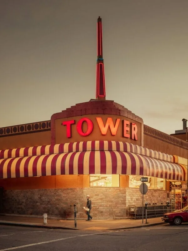 Vintage San Francisco tower building with neon sign and striped awning, fine art print by Ludwig Favre