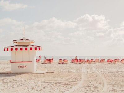White lifeguard stand on Miami Beach under a cloudy sky and turquoise water, fine art print by Ludwig Favre