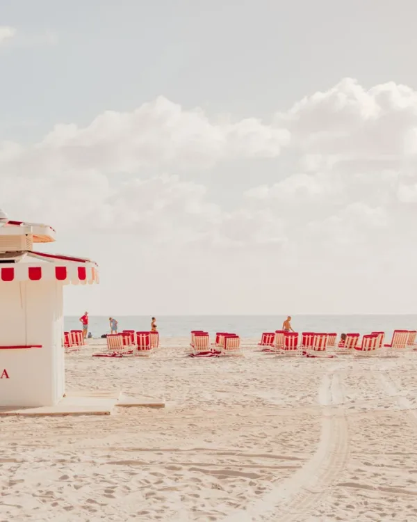 White lifeguard stand on Miami Beach under a cloudy sky and turquoise water — limited edition fine art print by Ludwig Favre
