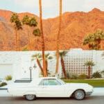 Vintage white Thunderbird parked in front of a Palm Springs home — limited edition fine art print by Ludwig Favre
