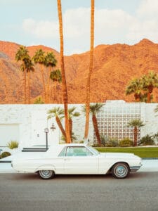 Vintage white Thunderbird parked in front of a Palm Springs home — limited edition fine art print by Ludwig Favre