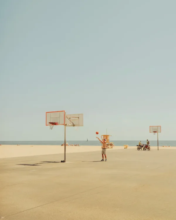Lone figure on an empty Balboa Beach basketball court under hazy California — limited edition fine art print by Ludwig Favre