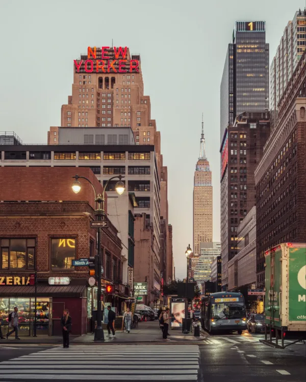 A street scene in New York City, featuring the New Yorker Building — limited edition fine art print by Ludwig Favre