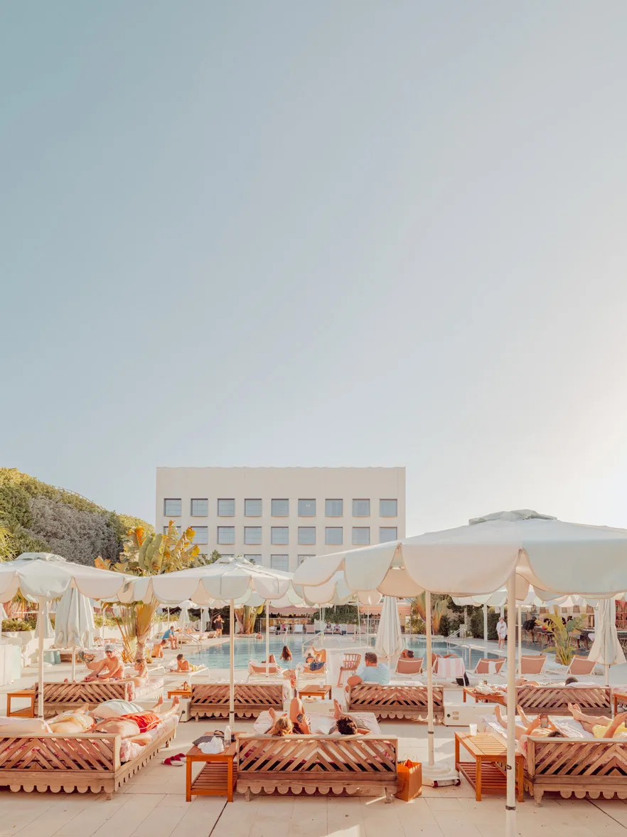 Luxurious Miami poolside scene with white umbrellas and lounge chairs — limited edition fine art print by Ludwig Favre
