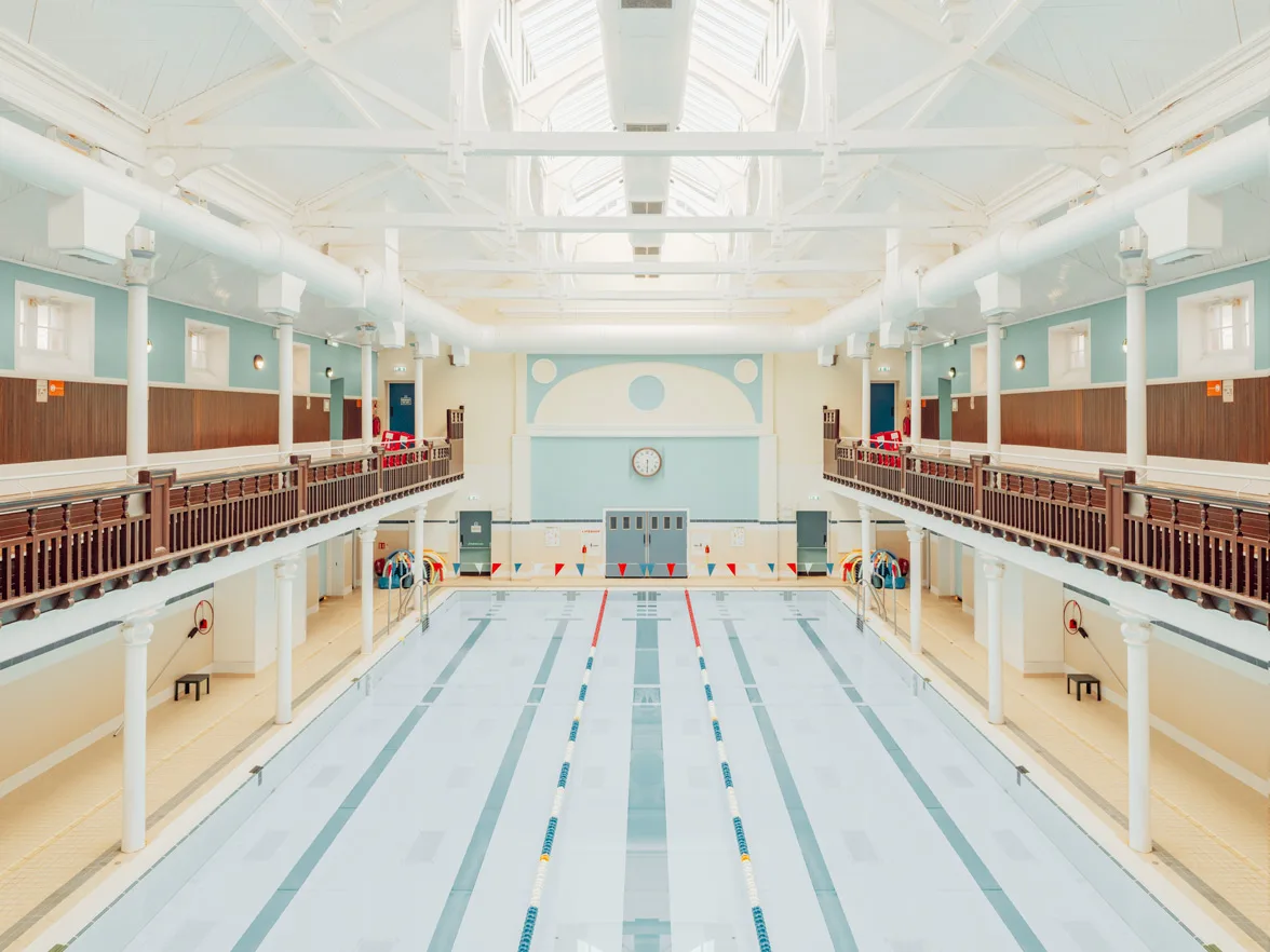 Pale blue Edinburgh swimming pool with Victorian architecture — limited edition fine art print by Ludwig Favre