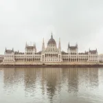 A wide shot of Budapest’s Parliament Building reflected in the Danube River — limited edition fine art print by Ludwig Favre