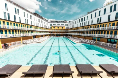 Aerial view of a turquoise Paris swimming pool with Art Deco architecture — limited edition fine art print by Ludwig Favre