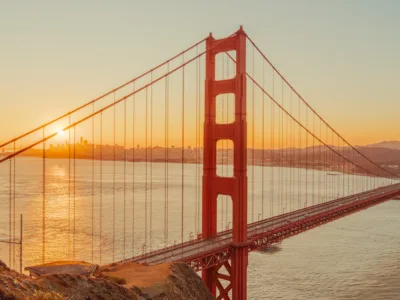 Golden Gate Bridge bathed in golden sunset light — limited edition fine art print by Ludwig Favre