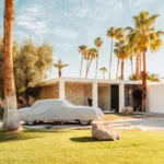 Covered classic car beneath palm trees in Palm Springs, California, limited edition fine art print by Ludwig Favre