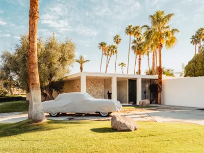 Covered classic car beneath palm trees in Palm Springs, California, limited edition fine art print by Ludwig Favre