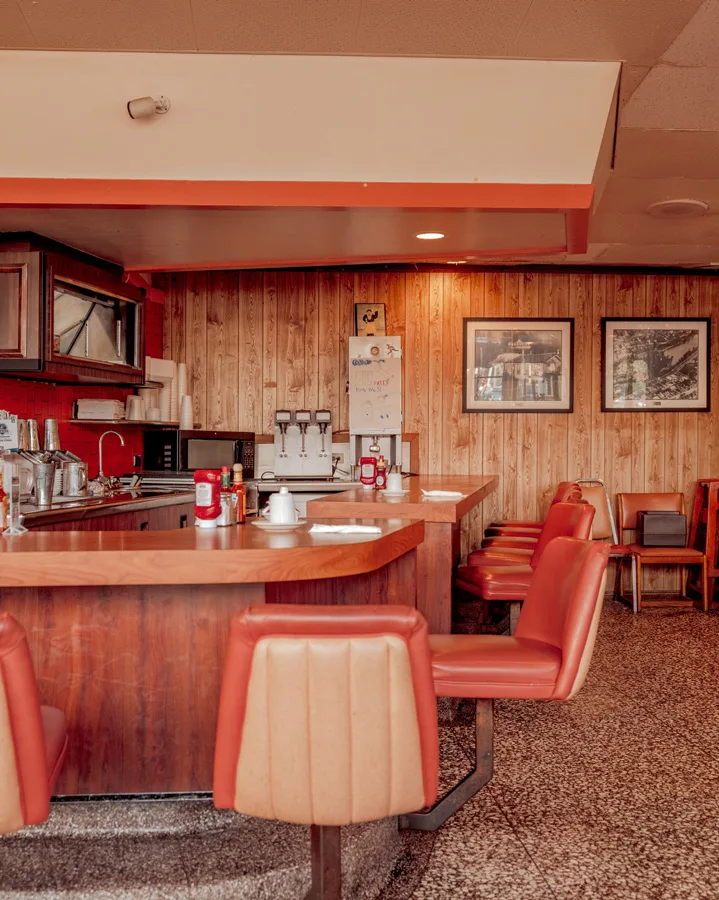 Retro Los Angeles diner under warm light — limited edition fine art print by Ludwig Favre Retro Los Angeles diner under warm light — limited edition fine art print by Ludwig Favre