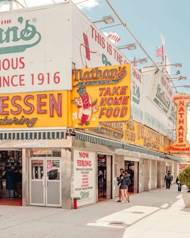 Vibrant Coney Island street with vintage signage — limited edition fine art print by Ludwig Favre