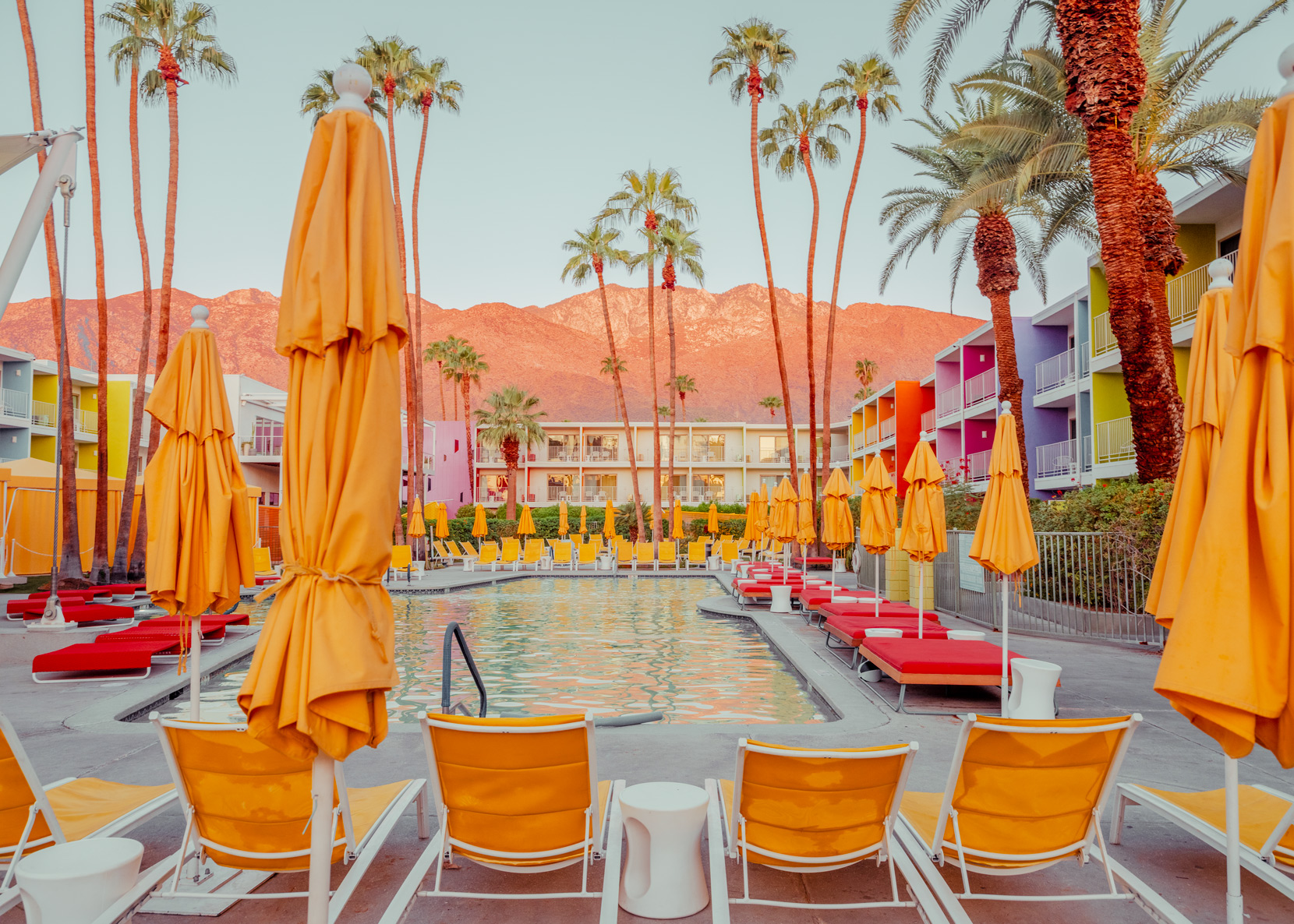 Sunlit Palm Springs poolside with mid-century lounge chairs — limited edition fine art print by Ludwig Favre