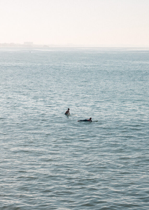 A surfer riding a wave in the Pacific Ocean off Los Angeles at soft morning light, limited edition fine art print by Ludwig Favre
