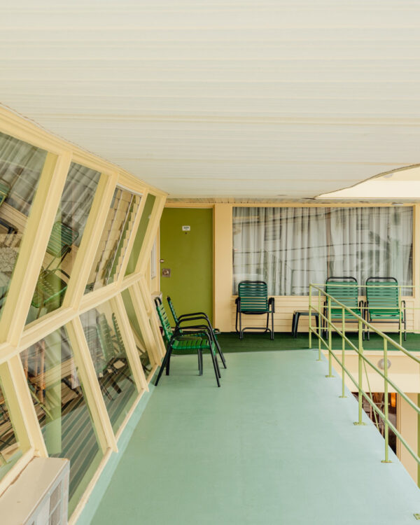 Green chairs on a mint-green balcony of the Caribbean Motel, Wildwood Crest, limited edition fine art photograph by Ludwig Favre