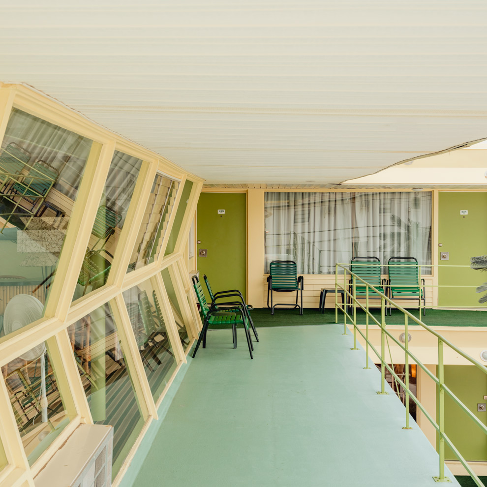 Green chairs on a mint-green balcony of the Caribbean Motel, Wildwood Crest, limited edition fine art photograph by Ludwig Favre