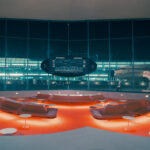 Red curved lounge seating and flight board at TWA Hotel New York print, limited edition fine art print by Ludwig Favre