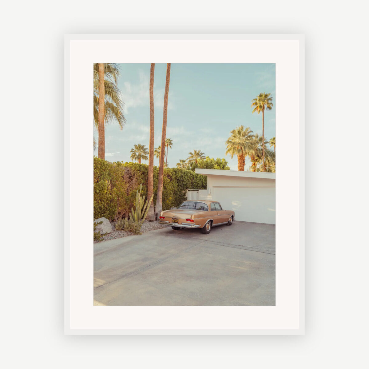 Vintage car in front of a mid-century modern home with palm trees, Palm Springs, framed fine art print with passe-partout